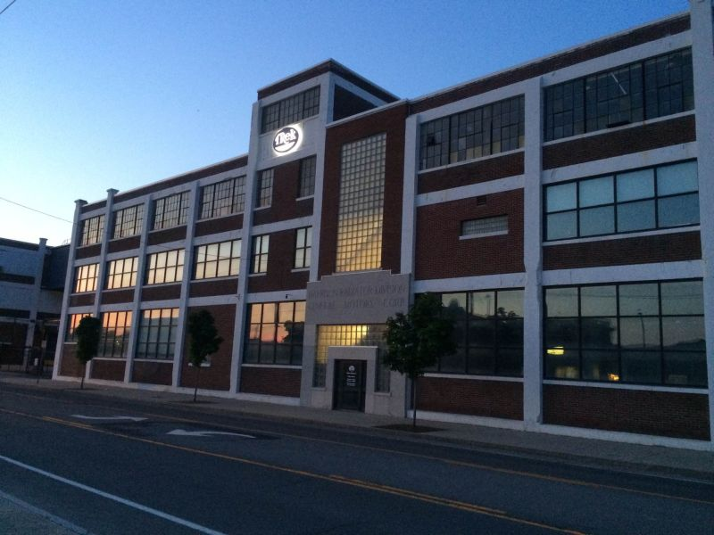 Historic brick factory incubator building at dusk
